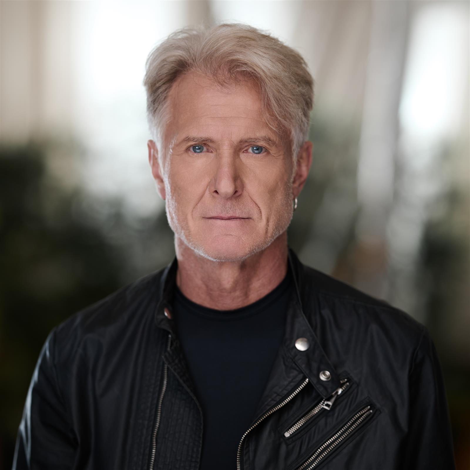 Vieslav Krystyan in a black leather jacket